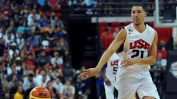 Aug 1, 2014; Las Vegas, NV, USA; USA Team White guard Klay Thompson (21) passes the ball during the USA Basketball Showcase at Thomas & Mack Center. Mandatory Credit: Stephen R. Sylvanie-USA TODAY Sports