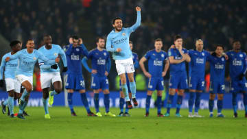 LEICESTER, ENGLAND - DECEMBER 19: Leicester City stand dejected as Bernardo Silva of Manchester City celebrates after they win the penalty shootout during the Carabao Cup Quarter-Final match between Leicester City and Manchester City at The King Power Stadium on December 19, 2017 in Leicester, England. (Photo by Catherine Ivill/Getty Images)