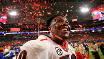 MIAMI GARDENS, FLORIDA - DECEMBER 31: Warren McClendon #70 of the Georgia Bulldogs reacts to the confetti after the Georgia Bulldogs defeated the Michigan Wolverines 36-11 in the Capital One Orange Bowl for the College Football Playoff semifinal game at Hard Rock Stadium on December 31, 2021 in Miami Gardens, Florida. (Photo by Kevin C. Cox/Getty Images)