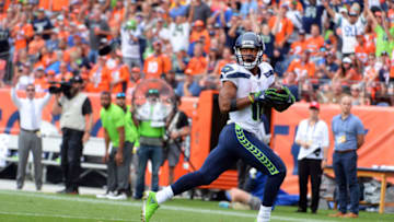 DENVER, CO - SEPTEMBER 9: Wide receiver Tyler Lockett #16 of the Seattle Seahawks runs for a touchdown against the Denver Broncos at Broncos Stadium at Mile High on September 9, 2018 in {Denver, Colorado. (Photo by Bart Young/Getty Images)