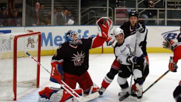 UNITED STATES - DECEMBER 22: New York Rangers' goalie Henrik Lundqvist defends as Tampa Bay Lightning's Rob DiMaio flips the puck into the air during the second period of game at Madison Square Garden. Lundqvist made 30 saves as the Rangers won, 4-2. (Photo by Howard Earl Simmons/NY Daily News Archive via Getty Images)