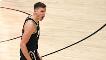 ATLANTA, GEORGIA - JUNE 29: Bogdan Bogdanovic #13 of the Atlanta Hawks celebrates a three point basket against the Milwaukee Bucks during the second half in Game Four of the Eastern Conference Finals at State Farm Arena on June 29, 2021 in Atlanta, Georgia. NOTE TO USER: User expressly acknowledges and agrees that, by downloading and or using this photograph, User is consenting to the terms and conditions of the Getty Images License Agreement. (Photo by Kevin C. Cox/Getty Images)