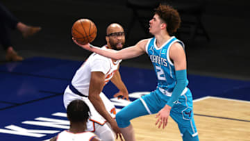 May 15, 2021; New York, New York, USA; LaMelo Ball #2 of the Charlotte Hornets heads for the net as Taj Gibson #67 and Julius Randle #30 of the New York Knicks defend in the second quarter at Madison Square Garden on May 15, 2021 in New York City. Mandatory Credit: Elsa/Pool Photo-USA TODAY Sports
