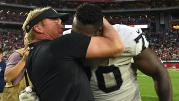 GLENDALE, AZ - NOVEMBER 18: Head coach Jon Gruden of the Oakland Raiders hugs Kelechi Osemele #70 after the NFL game against the Arizona Cardinals at State Farm Stadium on November 18, 2018 in Glendale, Arizona. The Oakland Raiders won 23-21. (Photo by Jennifer Stewart/Getty Images)