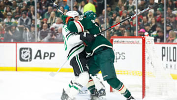 ST PAUL, MN - FEBRUARY 17: Ryan Suter #20 of the Dallas Stars and Jordan Greenway #18 of the Minnesota Wild get into a scrum in the first period of the game at Xcel Energy Center on February 17, 2023 in St Paul, Minnesota. (Photo by David Berding/Getty Images)