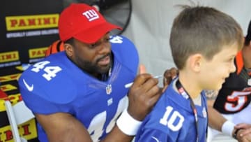 May 31, 2014; Los Angeles, CA, USA; New York Giants running back Andre Williams signs autographs during the 2014 NFLPA Rookie Premiere at the Los Angeles Memorial Coliseum. Mandatory Credit: Gary A. Vasquez-USA TODAY Sports