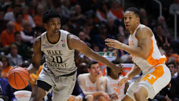 KNOXVILLE, TN - DECEMBER 22: Jaylen Hoard #10 of the Wake Forest Demon Deacons dribbles past Grant Williams #2 of the Tennessee Volunteers during the first half of their game at Thompson-Boling Arena on December 22, 2018 in Knoxville, Tennessee. (Photo by Donald Page/Getty Images)