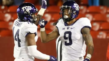 Oct 17, 2015; Ames, IA, USA; TCU Horned Frogs wide receiver Josh Doctson (9) and wide receiver Jarrison Stewart (14) celebrate a touchdown against the Iowa State Cyclones in the fourth quarter at Jack Trice Stadium. The Horned Frogs beat the Cyclones 45-21. Mandatory Credit: Reese Strickland-USA TODAY Sports