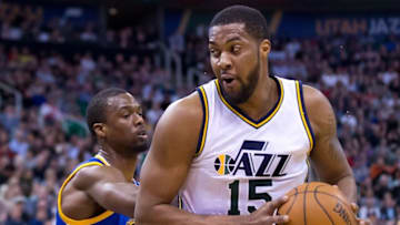 Mar 30, 2016; Salt Lake City, UT, USA; Golden State Warriors forward Harrison Barnes (40) defends against Utah Jazz forward Derrick Favors (15) during the first quarter at Vivint Smart Home Arena. Mandatory Credit: Russ Isabella-USA TODAY Sports