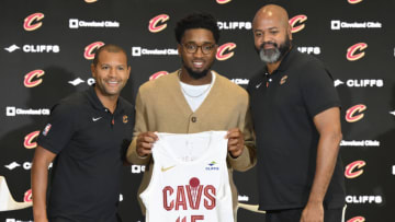 Sep 14, 2022; Cleveland, OH, USA; Cleveland Cavaliers guard Donovan Mitchell (center) poses with team president of basketball operations Koby Altman (left) and head coach J.B. Bickerstaff during an introductory press conference at Rocket Mortgage FieldHouse. Mandatory Credit: David Richard-USA TODAY Sports