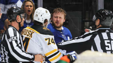 TORONTO, ON - APRIL 21: Jake DeBrusk #74 of the Boston Bruins battles against Morgan Rielly #44 of the Toronto Maple Leafs in Game Six of the Eastern Conference First Round during the 2019 NHL Stanley Cup Playoffs at Scotiabank Arena on April 21, 2019 in Toronto, Ontario, Canada. The Bruins defeated the Maple Leafs 4-2. (Photo by Claus Andersen/Getty Images)