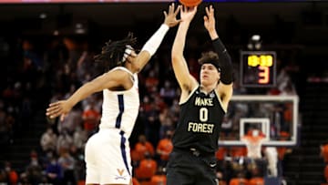 CHARLOTTESVILLE, VA - JANUARY 15: Jake LaRavia #0 of the Wake Forest Demon Deacons shoots over Armaan Franklin #4 of the Virginia Cavaliers in the first half during a game at John Paul Jones Arena on January 15, 2022 in Charlottesville, Virginia. (Photo by Ryan M. Kelly/Getty Images)