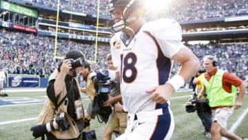 Sep 21, 2014; Seattle, WA, USA; Denver Broncos quarterback Peyton Manning (18) jogs off the field following a 26-20 overtime loss to the Seattle Seahawks at CenturyLink Field. Mandatory Credit: Joe Nicholson-USA TODAY Sports
