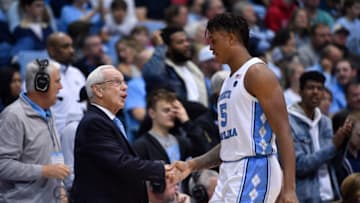 CHAPEL HILL, NORTH CAROLINA - NOVEMBER 15: Head coach Roy Williams talks with Armando Bacot #5 of the North Carolina Tar Heels during the second half of their game against the Gardner-Webb Runnin Bulldogs at the Dean Smith Center on November 15, 2019 in Chapel Hill, North Carolina. North Carolina won 77-61. (Photo by Grant Halverson/Getty Images)