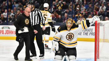 COLUMBUS, OH - JANUARY 14: Goaltender Tuukka Rask #40 of the Boston Bruins stays down on the ice as a trainer approaches after suffering an apparent injury early in the first period against the Columbus Blue Jackets on January 14, 2020 at Nationwide Arena in Columbus, Ohio. (Photo by Jamie Sabau/NHLI via Getty Images)
