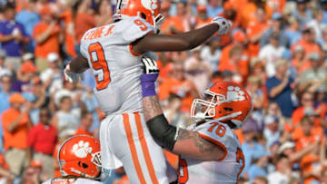 CHAPEL HILL, NORTH CAROLINA - SEPTEMBER 28: Travis Etienne #9 celebrates with teammate Sean Pollard #76 of the Clemson Tigers after scoring a touchdown against the North Carolina Tar Heels during the second quarter of their game at Kenan Stadium on September 28, 2019 in Chapel Hill, North Carolina. (Photo by Grant Halverson/Getty Images)