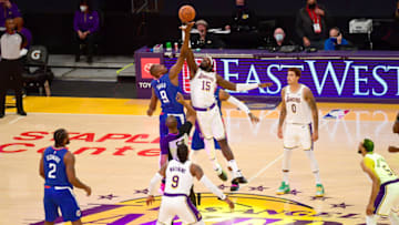 Dec 11, 2020; Los Angeles, California, USA; Los Angeles Clippers center Serge Ibaka (9) and Los Angeles Lakers center Montrezl Harrell (15) go up for a jump ball to start the game at Staples Center. Mandatory Credit: Jayne Kamin-Oncea-USA TODAY Sports