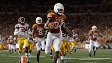 AUSTIN, TX - SEPTEMBER 15: Lil'Jordan Humphrey #84 of the Texas Longhorns catches a pass and runs for a touchdown in the second quarter defended by Marvell Tell III #7 of the USC Trojans and Isaiah Langley #24 at Darrell K Royal-Texas Memorial Stadium on September 15, 2018 in Austin, Texas. (Photo by Tim Warner/Getty Images)