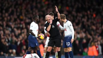 LONDON, ENGLAND - DECEMBER 02: Match Referee Mike Dean gestures as Aaron Ramsey consults teammate Alexandre Lacazette of Arsenal after a foul during the Premier League match between Arsenal FC and Tottenham Hotspur at Emirates Stadium on December 1, 2018 in London, United Kingdom. (Photo by Shaun Botterill/Getty Images)