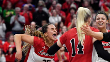 Louisville's Amaya Tillman (25) celebrates with her team after scoring a point during their NCAA Regional Final game against Oregon, Saturday, Dec. 10 2022 in Louisville Ky. Louisville defeated Oregon and will advance to the Final Four.Voboregonlouisvilletde014