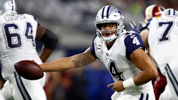 ARLINGTON, TX - NOVEMBER 30: Dak Prescott #4 of the Dallas Cowboys reaches to make a handoff in the first half of a football game against the Washington Redskins at AT&T Stadium on November 30, 2017 in Arlington, Texas. (Photo by Wesley Hitt/Getty Images)