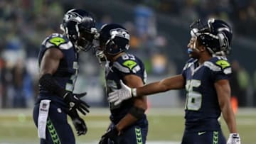 Nov 29, 2015; Seattle, WA, USA; Seattle Seahawks wide receiver Tyler Lockett (16) and wide receiver Doug Baldwin (89) celebrate strong safety Kam Chancellor (31) following an interception in the final minutes of the Pittsburgh Steelers game at CenturyLink Field. Mandatory Credit: Scott Olmos-USA TODAY Sports