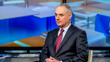 NEW YORK, NEW YORK - DECEMBER 18: Host Maria Bartiromo with MLB Commissioner Rob Manfred as he visits "Mornings With Maria" with Maria Bartiromo at Fox Business Network Studios on December 18, 2018 in New York City. (Photo by Roy Rochlin/Getty Images)