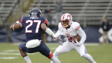 EAST HARTFORD, CT - NOVEMBER 10: SMU Mustangs running back Ke'Mon Freeman (2) looks to run while defended by UConn Huskies linebacker Omar Fortt (27) during the game between the UConn Huskies and the SMU Mustangs on November 10, 2018 at Rentschler Field in East Hartford, CT (Photo by Williams Paul/Icon Sportswire via Getty Images)