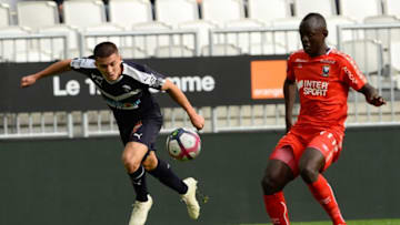 Bordeaux's Spanish defender Sergi Palencia (L) fights for the ball with Caen's Congolese midfielder Prince Oniangue during the French Ligue 1 football match between Bordeaux and Caen at the Matmut Atlantique stadium in Bordeaux, southwestern France on November 11, 2018. (Photo by NICOLAS TUCAT / AFP) (Photo credit should read NICOLAS TUCAT/AFP/Getty Images)