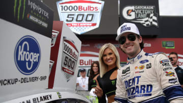 TALLADEGA, ALABAMA - OCTOBER 14: Ryan Blaney, driver of the #12 Dent Wizard Ford, celebrates in Victory Lane after winning the Monster Energy NASCAR Cup Series 1000Bulbs.com 500 at Talladega Superspeedway on October 14, 2019 in Talladega, Alabama. (Photo by Chris Graythen/Getty Images)