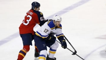 Feb 15, 2015; Sunrise, FL, USA; St. Louis Blues left wing Jaden Schwartz (17) skates with the puck as Florida Panthers center Dave Bolland (63) defends in the third period at BB&T Center. Mandatory Credit: Robert Mayer-USA TODAY Sports