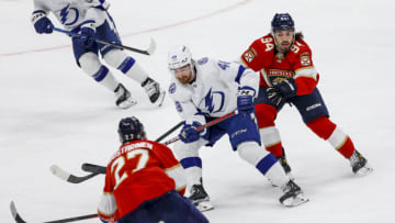 Feb 6, 2023; Sunrise, Florida, USA; Tampa Bay Lightning defenseman Nick Perbix (48) moves the puck ahead of Florida Panthers left wing Ryan Lomberg (94) during the second period at FLA Live Arena. Mandatory Credit: Sam Navarro-USA TODAY Sports