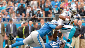 CHARLOTTE, NC - SEPTEMBER 14: Ezekiel Ansah #94 and Jason Jones #91 of the Detroit Lions tackle Cam Newton #1 of the Carolina Panthers during their game at Bank of America Stadium on September 14, 2014 in Charlotte, North Carolina. (Photo by Grant Halverson/Getty Images)