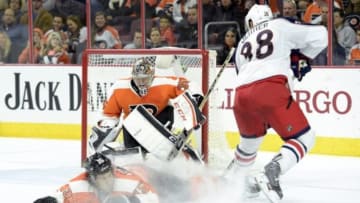 Nov 14, 2014; Philadelphia, PA, USA; Philadelphia Flyers defenseman Michael Del Zotto (15) slides to block shot against Columbus Blue Jackets center Boone Jenner (38) in front of goalie Steve Mason (35) during the third period at Wells Fargo Center. The Blue Jackets defeated the Flyers, 4-3. Mandatory Credit: Eric Hartline-USA TODAY Sports