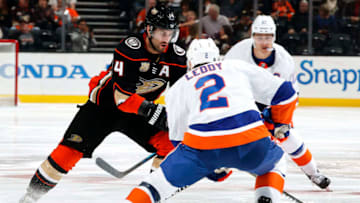 ANAHEIM, CA - OCTOBER 17: Adam Henrique #14 of the Anaheim Ducks skates with the puck against Nick Leddy #2 of the New York Islanders during the game on October 17, 2018 at Honda Center in Anaheim, California. (Photo by Debora Robinson/NHLI via Getty Images)