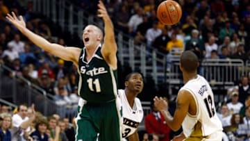 KANSAS CITY, MO - NOVEMBER 19: Drew Neitzel #11 of the Michigan State Spartans loses the ball as it falls in front of Stefhon Hannah #3 and Jason Horton #12 of the Missouri Tigers during the O'Reilly Auto Parts CBE Classic semifinal game on November 19, 2007 at the Sprint Center in Kansas City, Missouri. (Photo by Jamie Squire/Getty Images)