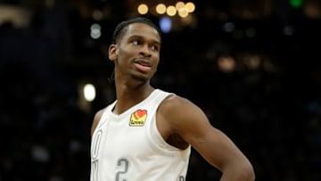 Shai Gilgeous-Alexander #2 of the Oklahoma City Thunder looks over towards the Bucks bench during the second half of the game against the Milwaukee Bucks at Fiserv Forum on November 19, 2021 in Milwaukee, Wisconsin. Bucks defeated the Thunder 96-89. (Photo by John Fisher/Getty Images)