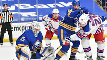 Jan 26, 2021; Buffalo, New York, USA; New York Rangers left wing Chris Kreider (20) shoots the puck close range as Buffalo Sabres goaltender Linus Ullmark (35) makes the stop in the third period at KeyBank Center. Mandatory Credit: Mark Konezny-USA TODAY Sports