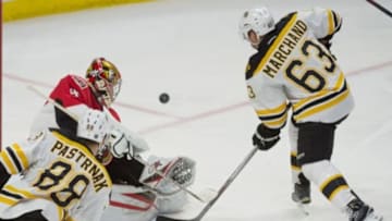 Jan 9, 2016; Ottawa, Ontario, CAN; Ottawa Senators goalie Craig Anderson (41) makes a save in front of Boston Bruins left wing Brad Marchand (63) in the third period at the Canadian Tire Centre. The Senators defeated the Bruins 2-1 in overtime. Mandatory Credit: Marc DesRosiers-USA TODAY Sports