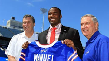 Apr 26, 2013; Orchard Park, NY, USA; Buffalo Bills Buffalo Bills head coach Doug Marrone (left), first round draft pick quarterback E.J. Manuel (middle) and general manager Buddy Nix pose for a photo at the press conference at Ralph Wilson Stadium. Mandatory Credit: Kevin Hoffman-USA TODAY Sports
