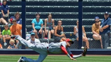 Jul 2, 2014; San Diego, CA, USA; Cincinnati Reds center fielder Billy Hamilton (6) dives but cannot get catch a ball off the bat of San Diego Padres catcher Rene Rivera (not pictured) during the first inning at Petco Park. Three runs would score on the play. Mandatory Credit: Jake Roth-USA TODAY Sports