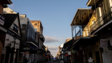 NEW ORLEANS, LA - FEBRUARY 16: An empty Bourbon Street is seen in the evening on February 16, 2021 in New Orleans, Louisiana. Traditional Mardi Gras celebrations have been disrupted by the COVID-19 pandemic, including the cancelling of all carnival parades and the closing of all bars in the French Quarter until Wednesday. Patrons are allowed into barricaded areas only if they are visiting a restaurant or staying in a hotel. (Photo by Jon Cherry/Getty Images)