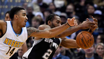 DENVER, CO - JANUARY 05: Denver Nuggets guard Gary Harris (14) almost gets his hand on the ball as San Antonio Spurs forward Kawhi Leonard (2) reaches out to grab the pass during the fourth quarter January 5, 2016 at Pepsi Center. The Spurs defeated the Nuggets 127-99. (Photo By John Leyba/The Denver Post via Getty Images)
