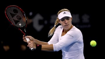 BEIJING, CHINA - OCTOBER 02: Angelique Kerber of Germany returns a shot against Alize Cornet on day three of the 2017 China Open at the China National Tennis Centre on October 1st, 2017 in Beijing, China. (Photo by Emmanuel Wong/Getty Images)