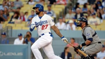 Jul 11, 2014; Los Angeles, CA, USA; Los Angeles Dodgers center fielder Matt Kemp (27) follows through on a run-scoring single in the first inning against the San Diego Padres at Dodger Stadium. Mandatory Credit: Kirby Lee-USA TODAY Sports