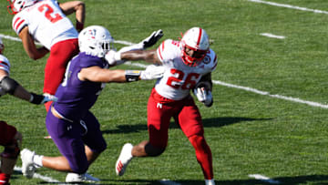 Nov 7, 2020; Evanston, Illinois, USA; Nebraska Cornhuskers running back Dedrick Mills (26) runs against the Northwestern Wildcats during the first half at Ryan Field. Mandatory Credit: David Banks-USA TODAY Sports
