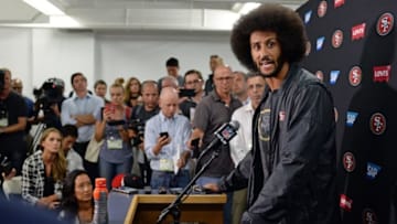 Sep 1, 2016; San Diego, CA, USA; San Francisco 49ers quarterback Colin Kaepernick (right) talks to media after the game against the San Diego Chargers at Qualcomm Stadium. Mandatory Credit: Jake Roth-USA TODAY Sports