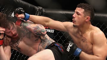 PHOENIX, AZ - JANUARY 15: Drakkar Klose (R) throws a right on Devin Powell during the UFC Fight Night event at the at Talking Stick Resort Arena on January 15, 2017 in Phoenix, Arizona. (Photo by Christian Petersen/Getty Images)