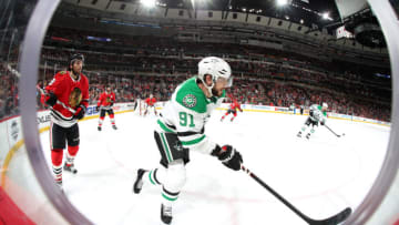 CHICAGO, IL - FEBRUARY 08: Tyler Seguin #91 of the Dallas Stars skates in front of Nick Schmaltz #8 of the Chicago Blackhawks in the third period at the United Center on February 8, 2018 in Chicago, Illinois. (Photo by Chase Agnello-Dean/NHLI via Getty Images)