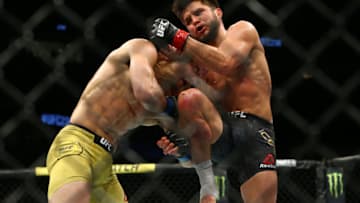 CHICAGO, IL - JUNE 08: Henry Cejudo (r) knees Marlon Moraes of Brazil (l) in their bantamweight championship bout during the UFC 238 event at United Center on June 8, 2019 in Chicago, Illinois. (Photo by Rey Del Rio/Getty Images)